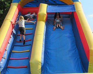 Neighbors | Jessica Harker.Children and their families played on bounce houses at the annual Celebrate Poland event behind Town Hall June 28.