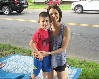 Neighbors | Jessica Harker.Eve Carlton and her son, Calvin, set up to enjoy the Fireman's Parade June 28 at the annual Celebrate Poland celebration.