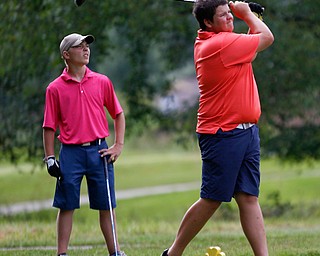 Nathan Kelly, right, of East Liverpool, and Anthony Cesario, of Niles, watch the ball after Kelly drove it during the 14u Greatest Golfer junior qualifier at Tam O'Shanter Golf Course in Hermitage, Pa. on Thursday. EMILY MATTHEWS | THE VINDICATOR