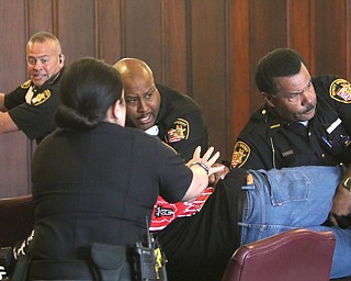  ROBERT K.YOSAY  | THE VINDICATOR..Mahoning County deputies had to stun a man and arrested two people after they attacked a man who was to be sentenced in common pleas court for killing a woman in June 2017...A son of Elizabeth Stewart and another man attacked Dale Williams, 46, jumping over a table and grabbing Williams and punching him.