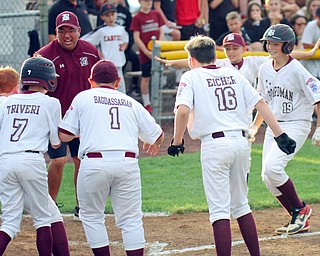 William D. Lewis The Vindicator Boardman's Mason Nawrocki(19) , right, gets congrats from team mates after hitting game winning homer in game with Canfield.