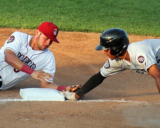 William D. Leiws The Vindicator  ScrappersHenry Pujols(8) tries to tag Renegades Greg Joneswho was safe at 3rd  during 71-15-19 action at Eastwood.