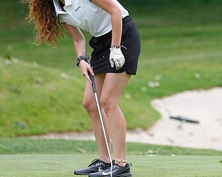 Eileen McHale, of Canfield, watches her putt during the Greatest Golfer Juniors U17 at Avalon Lakes Golf Course on Tuesday. EMILY MATTHEWS | THE VINDICATOR