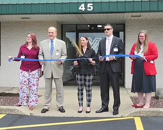 Neighbors | Jessica Harker .Valor Recovery employees Peyten Cram, President James Conti, Misy Long, Treasurer Gabe Crafton and Nicole Brubaker posed outside of the building to cut the ribbon celebrating the recieval of two awards.
