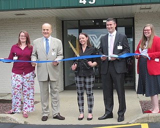 Neighbors | Jessica Harker .Standing outside of Valor Recovery employees Peyten Cram, President James Conti, Misy Long, Treasurer Gabe Crafton and Nicole Brubaker cut the ribbon celebrating the opening of new services at the facility.