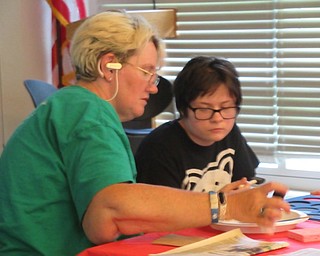 Neighbors | Jessica Harker .Community members gathered at the Austintown Library June 6 to create moon phase tshirts.