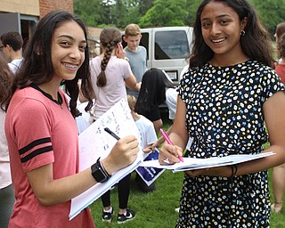 Neighbors | Abby Slanker.Canfield Village Middle School eighth-grade students commemorated the end of their middle school years by signing yearbooks at the school's annual Eighth-Grade Picnic.