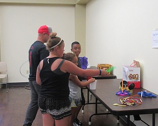 Neighbors | Jessica Harker .Community members played carnival games at the Boardman library July 11.