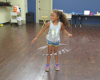 Neighbors | Jessica Harker .Hula hoops were available for children to play with during the Boardman library's carnival games event.
