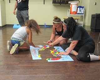 Neighbors | Jessica Harker .A puzzle of the United States was available for community members to try their hand at putting together at the Boardman library on July 11.