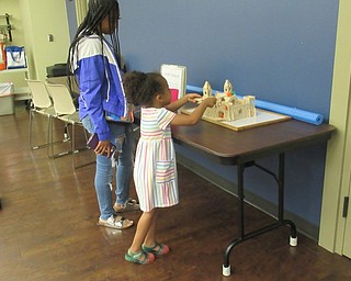 Neighbors | Jessica Harker .Children played castle catapult at the Boardman library's carnival games event on July 11.