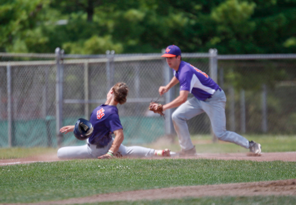 Creekside Fitness' Grant Metzger tags out New York Nines' Griffin Arnone during the NABF World Series championship game at Cene Park on Sunday. Creekside lost 5-0. EMILY MATTHEWS | THE VINDICATOR