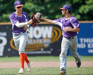 Creekside Fitness' Harrison Pontoli, left, and Michael Budde high-five as they run off the field during the NABF World Series championship game against the New York Nines at Cene Park on Sunday. Creekside lost 5-0. EMILY MATTHEWS | THE VINDICATOR