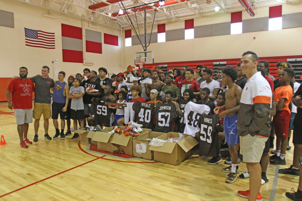  ROBERT K.YOSAY  | THE VINDICATOR..Cleveland Browns officials visited...Chaney High School - girard.. and one other school to make a donation to the CowboysÕ football and