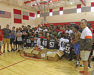  ROBERT K.YOSAY  | THE VINDICATOR..Cleveland Browns officials visited...Chaney High School - girard.. and one other school to make a donation to the CowboysÕ football and