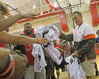  ROBERT K.YOSAY  | THE VINDICATOR..Cleveland Browns officials visited...Chaney High School - girard.. and one other school to make a donation to the CowboysÕ football and .Adam Weber... passes out jerseys...