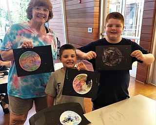 Neighbors | Submitted.Ginger Zink, and her grandsons, Jackson and Israel, attended the Water Color Planet making event at the Michael Kusalaba library on June 10.