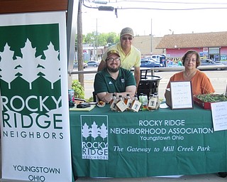 Neighbors | Jessica Harker .John Slanina, James Chizmar and Patricia Sveth represented Rocky Ridge Neighbors at the Michael Kusalaba library, selling locally made maple syrup.