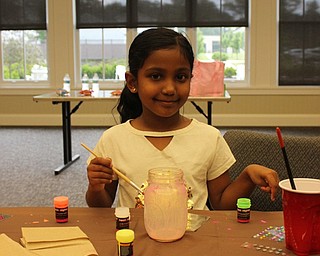 Neighbors | Abby Slanker.Aadya Sarma of Canfield decorated a glow in the dark jar to take home from the Canfield library.