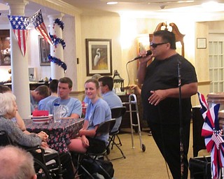 Neighbors | Jessica Harker .Singer Michael Angelo Prisco performed for residents of Poland Sunrise at the home's Fourth of July celebration.