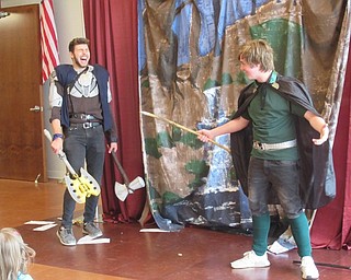Neighbors | Jessica Harker .An actor playing Thor laughed at his brother Loki during a performance of the Legends of Asgard July 16 at the Michael Kusalaba library.