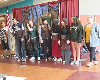 Neighbors | Jessica Harker .The cast of the Brockway Bizon traveling theater company bowed after their performance of The Legends of Asgard for community members gathered at the Michael Kusalaba library.