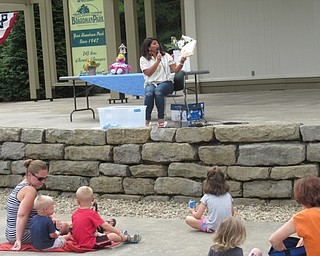 Neighbors | Jessica Harker.Children gathered with their families at the Boardman Park July 16 to listen to park employee Anne-Marie Turner read during the Preschoolers in the Park event.
