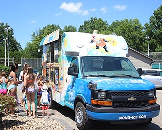 Neighbors | Abby Slanker.Members of the Canfield Swim and Tennis Club lined up at the Kona Ice truck during the Canfield Swim and Tennis Club's 50th anniversary celebration on July 14.