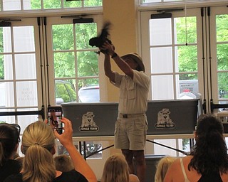 Neighbors | Jessica Harker .Jungle Terry brought a Chinese silky chicken, named Chickey, to the Poland library July 16.