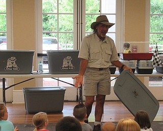 Neighbors | Jessica Harker .Jungle Terry demonstrated how a tree frog can stick to almost any surface during his show at the Poland library July 16.