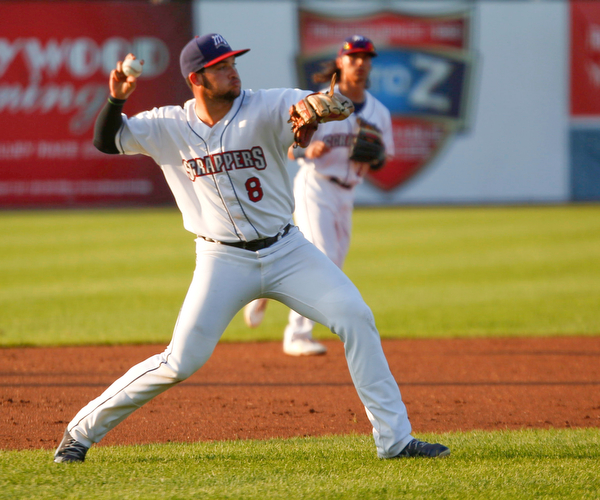 Scrappers' Henry Pujols throws the ball to first during their game against the Spikes at Eastwood Field on Thursday night. EMILY MATTHEWS | THE VINDICATOR