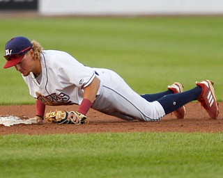 Scrappers' Raynel Delgado dives into second to make the out during their game against the Spikes at Eastwood Field on Thursday night. EMILY MATTHEWS | THE VINDICATOR