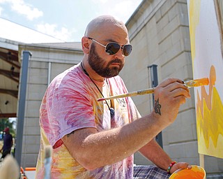James Shuttic, of Warren, paints at the Warren Walk Against Heroin at the Warren Amphitheater on Sunday. EMILY MATTHEWS | THE VINDICATOR