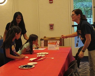 Neighbors | Jessica Harker .Librarian Romie Policy showed community members how to create their own Forky, a character in the new Toy Story movie June 20.