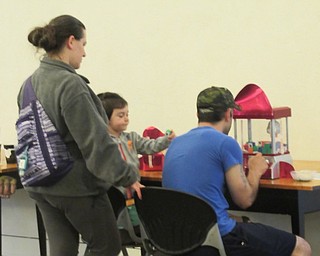 Neighbors | Jessica Harker .Children and their families were able to play a claw machine game June 20 at the Austintown library's Toy Box Takeover event celebrating the upcoming release of the new Toy Story movie.