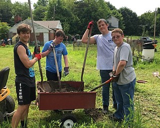 Neighbors | Submitted.Student members of the Ulster Project, both locally and from Northern Ireland, are pictured working at the Jubilee Gardens.