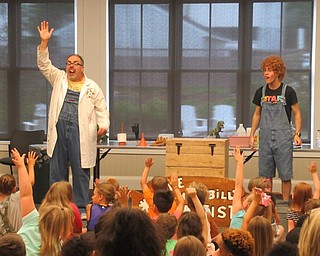 Neighbors | Jessica Harker .Children gathered at the Canfiled library on July 12 to watch the Hillbilly Silly Science Show.