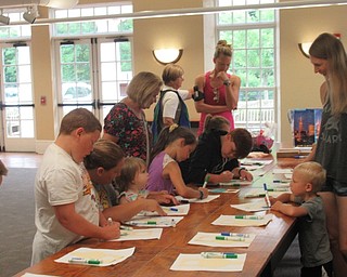 Neighbors | Jessica Harker .Children and their families gathered at the Poland library for the Green Team's visit from Mother Earth.