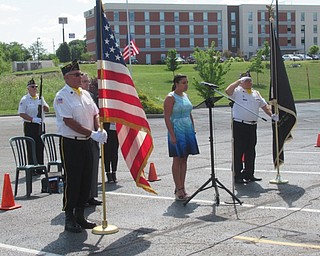 Neighbors | Jessica Harker .AnnaMaria Jadue, a YSU alumna, sung the National Anthem at Quaker Steak and Lube's dedication ceremony July 23.