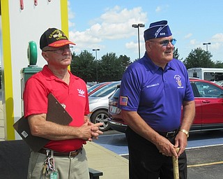 Neighbors | Jessica Harker .Local veterans Ken Jakubec and Leo Connelly attended the dedication ceremony July 23 that they organized after spear heading a project to get six benches donated to local fallen soliders and flag poles honoring all branches of service outside of the Austintown Quaker Steak and Lube.
