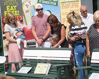 Neighbors | Jessica Harker .Gold star family members of David Eisenbraum surrounded a bench dedicated in his honor July 23. Family members included Eisenbraum's sister, Jenny Kennedy, who donated money for the purchase of five of the six benches dedicated to fallen soliders at the Austintown Quaker Steak and Lube.