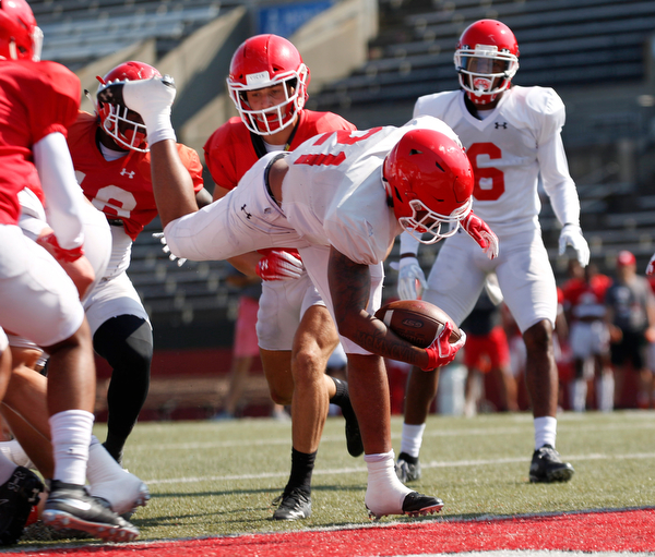London Pearson dives into the end zone to score a touchdown during YSU's scrimmage Saturday morning at Stambaugh Stadium. EMILY MATTHEWS | THE VINDICATOR
