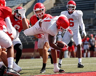 London Pearson dives into the end zone to score a touchdown during YSU's scrimmage Saturday morning at Stambaugh Stadium. EMILY MATTHEWS | THE VINDICATOR
