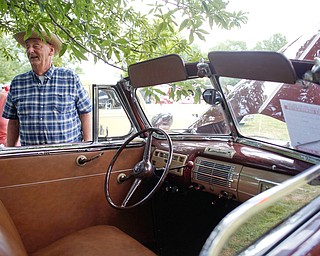Jessica Foor, left, and her father Clyde Foor, both of Poland, stand next to their original 1944 Ford Deluxe at the 41st annual Cars in the Park car show in Boardman Park on Sunday afternoon. Proceeds from the car show will go to Harper, Foley, 4, who has Dravet Syndrome, a catastrophic form of epilepsy. EMILY MATTHEWS | THE VINDICATOR