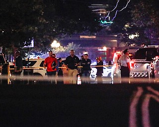 Authorities work the scene of a mass shooting, Sunday, Aug. 4, 2019, in Dayton, Ohio. A several people in Ohio have been killed in the second mass shooting in the U.S. in less than 24 hours, and the suspected shooter is also deceased, police said. (AP Photo/John Minchillo)