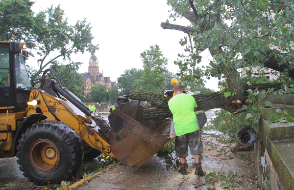William D. Lewis the vindicator Warren City crews work at removing  downed tree on hte West Mrket St Bridge i in Warren after fast moving storm hit Tuesday 8-6-19 afternoon.