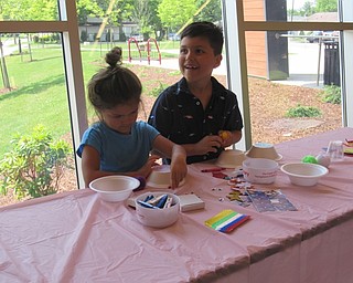 Neighbors | Jessica Harker .Norah and Gavin Anderson worked on making space ships out of styrofoam plates and bowls at the Michael Kualaba library July 2.