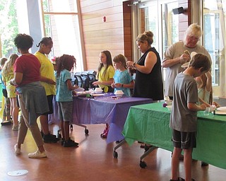 Neighbors | Jessica Harker .Children gathered at the Michael Kusalaba library on July 2 to work on space themed crafts organized by Children's Librarian Rhonda Monroe.