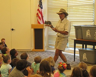 Neighbors | Jessica Harker.Performer Jungle Terry brought a chinchilla to the Austintown library July 10 for his show.