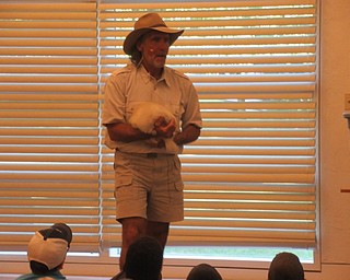 Neighbors | Jessica Harker .Jungle Terry brought an albino skunk named Aspen to the Austintown library July 10 for his performance.